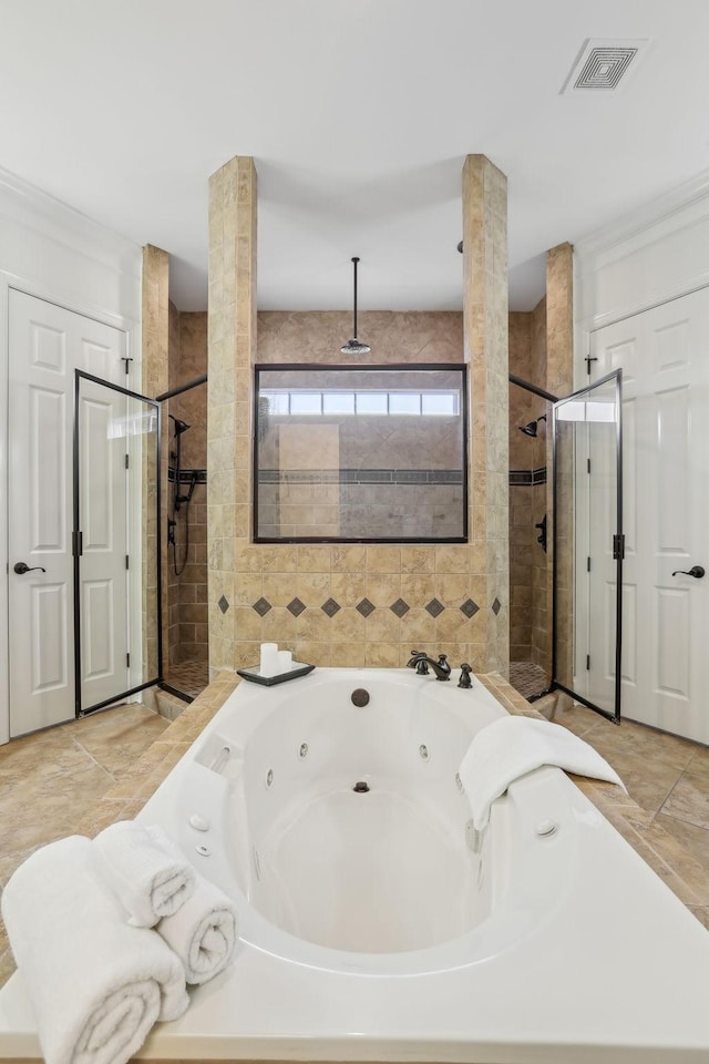 bathroom with separate shower and tub and ornate columns