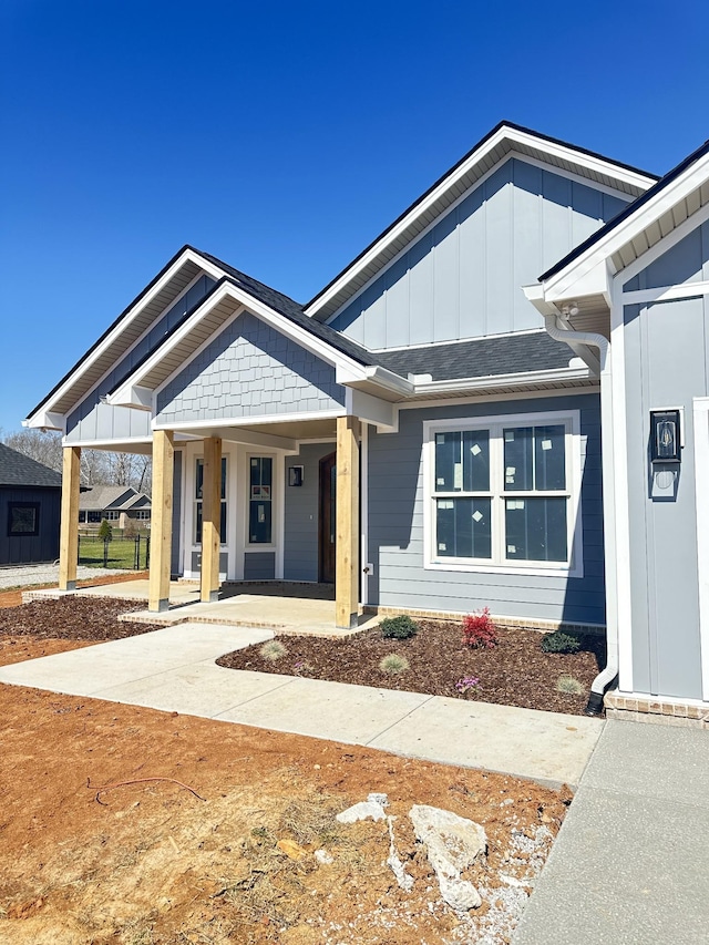 view of front facade featuring a porch and board and batten siding