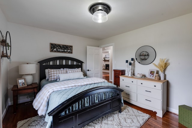 bedroom featuring dark wood-type flooring