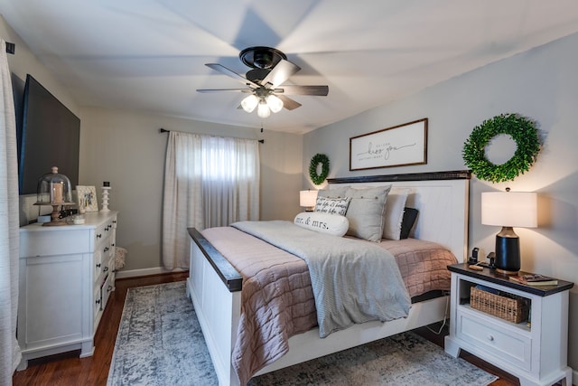 bedroom featuring ceiling fan and dark wood-type flooring