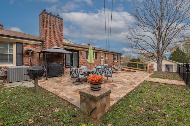 view of patio / terrace featuring central AC unit and a grill