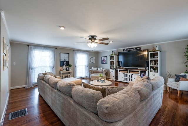 living room with ceiling fan, crown molding, and dark wood-type flooring