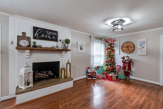 living room featuring a fireplace, hardwood / wood-style floors, and crown molding