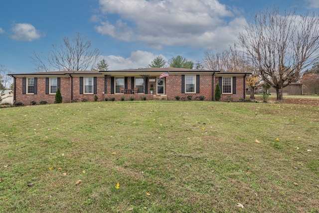 ranch-style house featuring a front lawn