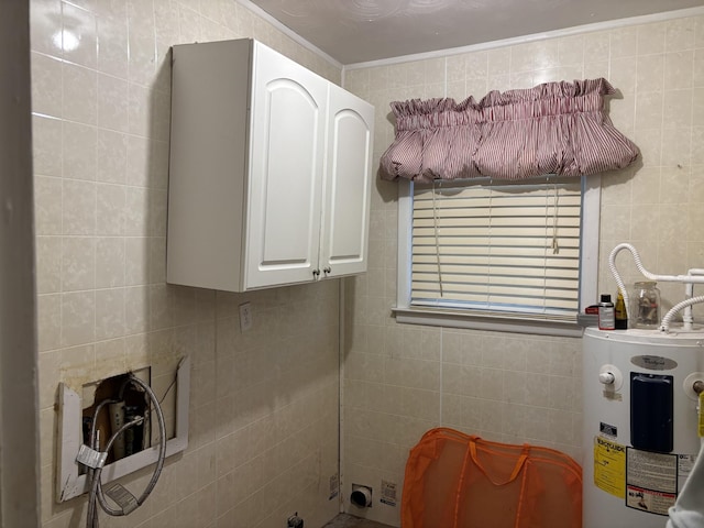 bathroom featuring electric water heater and tile walls