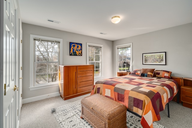 bedroom with light carpet