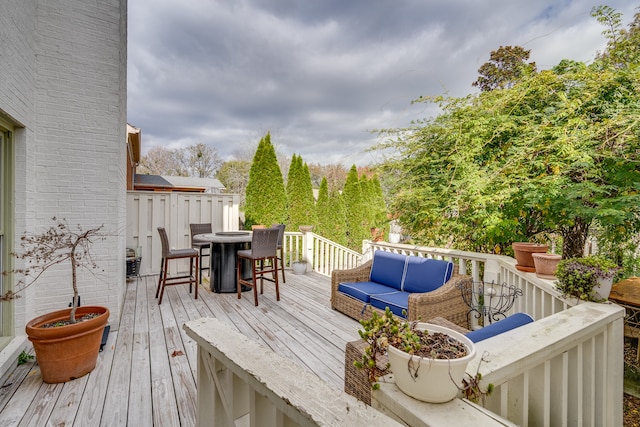 wooden deck featuring an outdoor living space