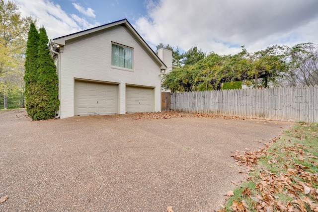 view of side of property with a garage