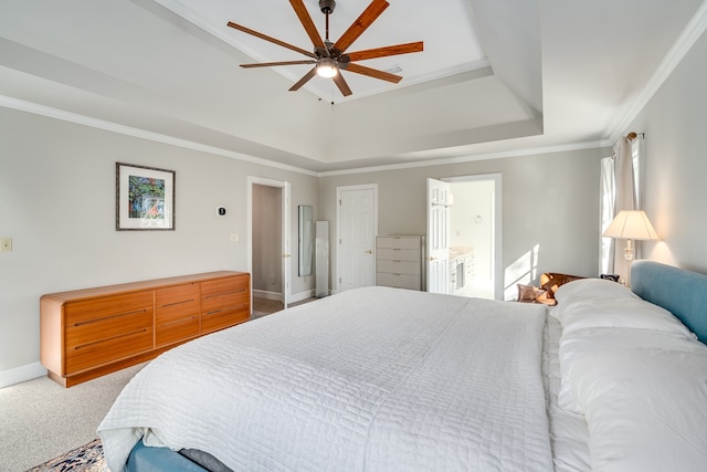 carpeted bedroom featuring ensuite bath, ceiling fan, and ornamental molding