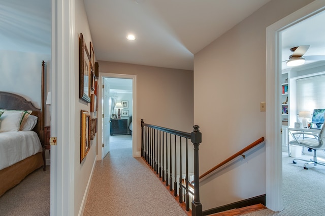 corridor with light colored carpet