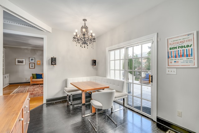 dining area featuring a notable chandelier, breakfast area, and dark wood-type flooring