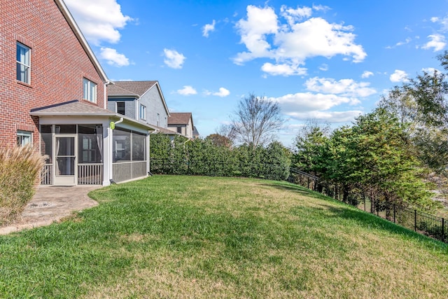 view of yard featuring a sunroom