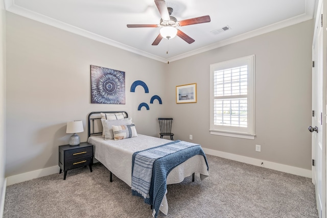 carpeted bedroom with ceiling fan and crown molding