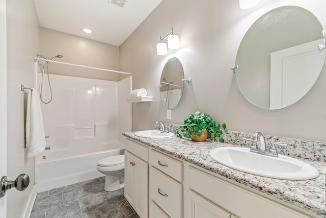 full bathroom featuring shower / washtub combination, vanity, and toilet