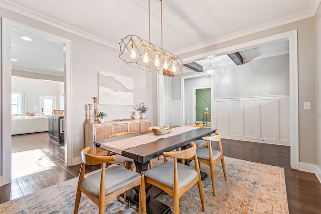 dining room with beamed ceiling, crown molding, and dark wood-type flooring