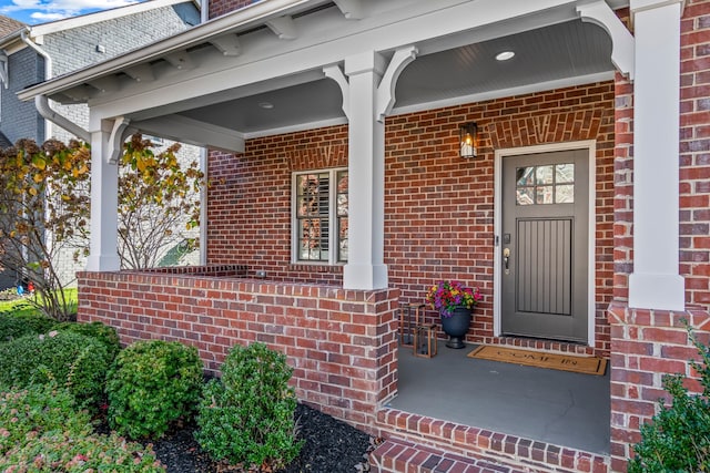 doorway to property featuring a porch