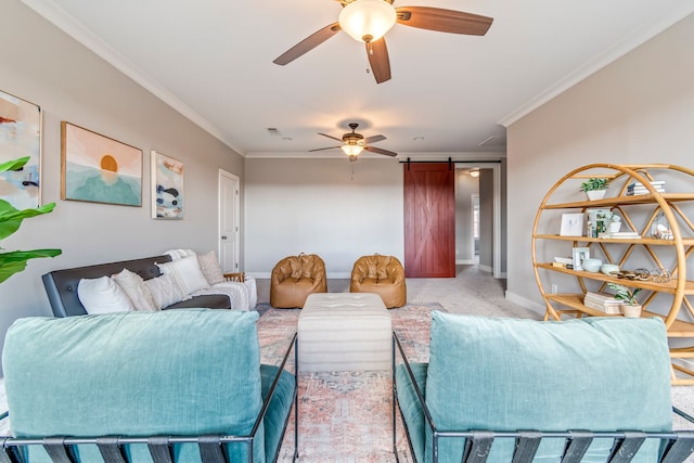 living room featuring light carpet, a barn door, ceiling fan, and crown molding