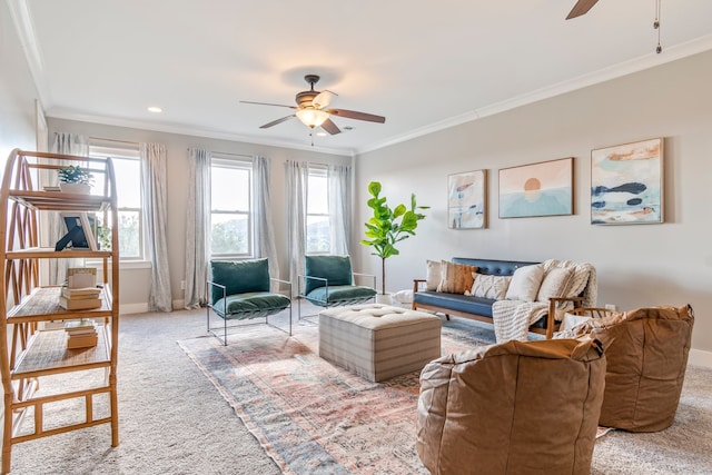 carpeted living room featuring crown molding, ceiling fan, and a healthy amount of sunlight