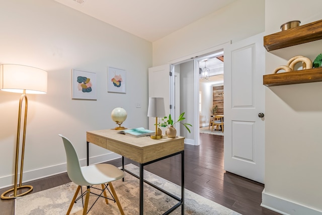 home office with dark hardwood / wood-style floors