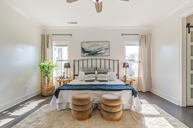 bedroom with multiple windows, ceiling fan, dark wood-type flooring, and ornamental molding