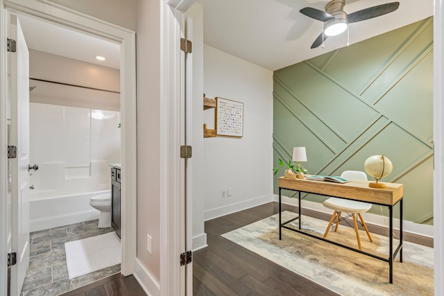 office featuring dark hardwood / wood-style floors and ceiling fan