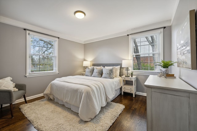 bedroom with dark hardwood / wood-style flooring and ornamental molding