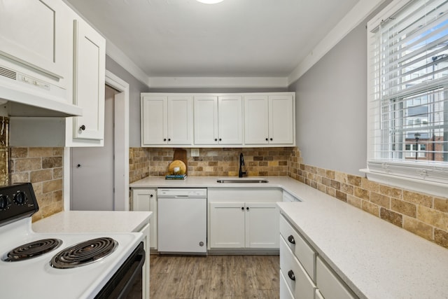 kitchen featuring white cabinets, light hardwood / wood-style floors, white appliances, and a wealth of natural light