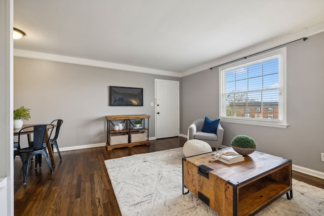 living room with crown molding and dark hardwood / wood-style floors