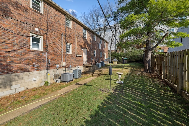 view of yard with central AC