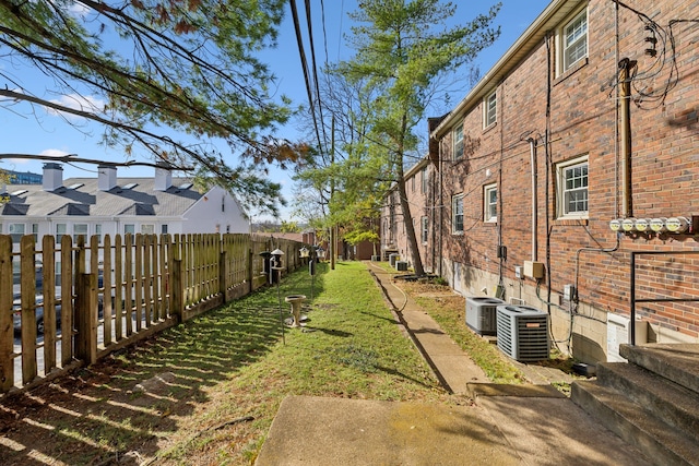 view of yard with central air condition unit