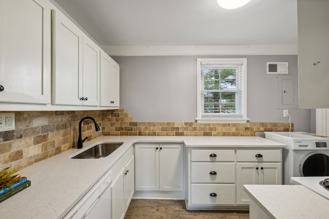 washroom with cabinets, washer / dryer, light wood-type flooring, and sink