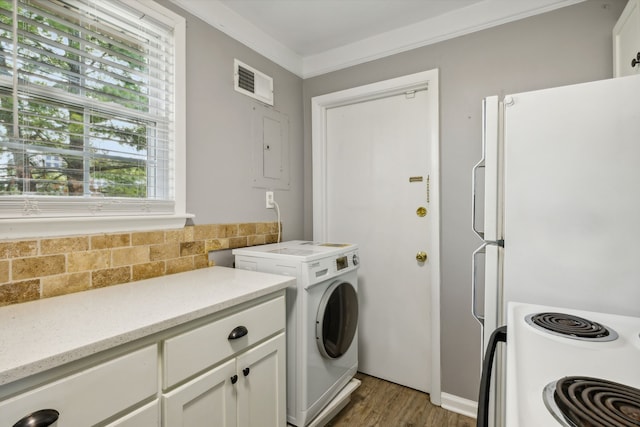 washroom with washer / clothes dryer, crown molding, dark hardwood / wood-style flooring, and electric panel