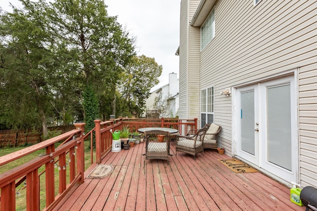 wooden deck featuring french doors