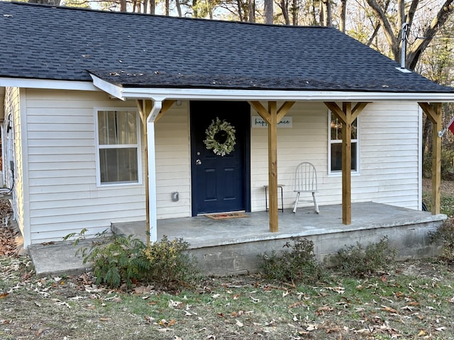 view of exterior entry with covered porch