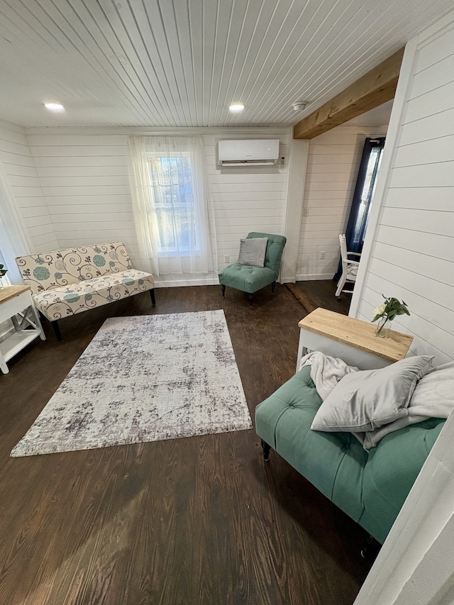 living room with dark hardwood / wood-style floors, a wall mounted AC, wood ceiling, and wood walls