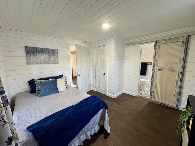 bedroom with ensuite bath and wooden ceiling