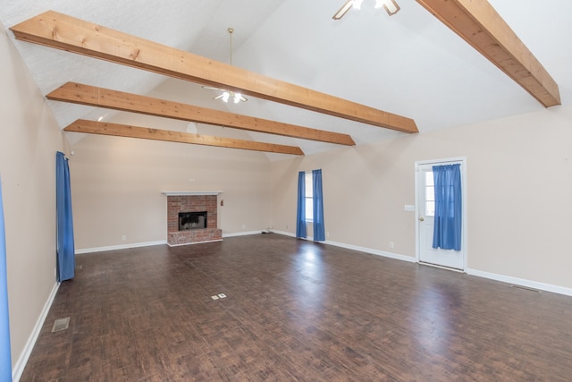 unfurnished living room featuring high vaulted ceiling, ceiling fan, a fireplace, beamed ceiling, and dark hardwood / wood-style flooring