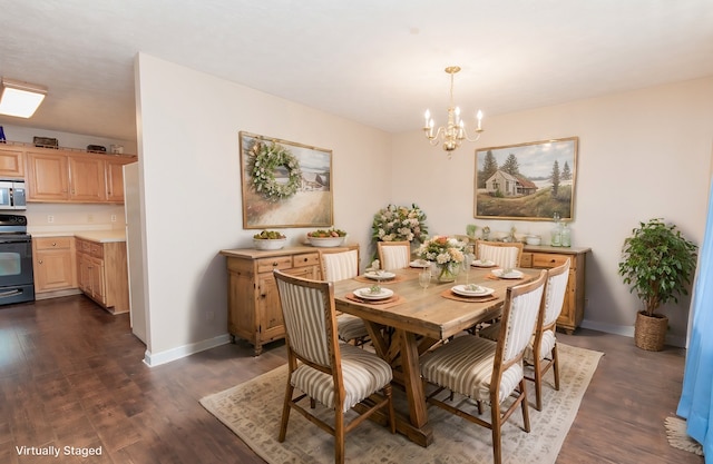 dining space with dark hardwood / wood-style floors and an inviting chandelier