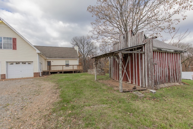 exterior space featuring a garage and a deck