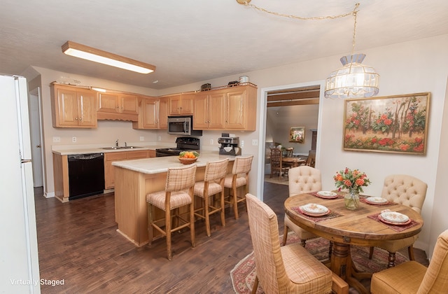 kitchen featuring pendant lighting, light brown cabinets, black appliances, sink, and dark hardwood / wood-style flooring