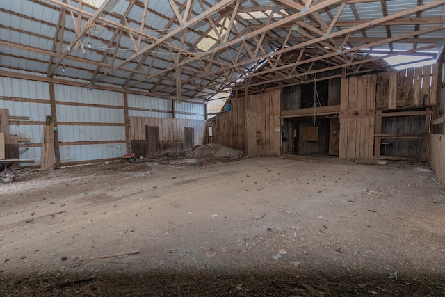 miscellaneous room featuring high vaulted ceiling