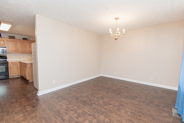 interior space featuring a notable chandelier, dark hardwood / wood-style flooring, and a textured ceiling