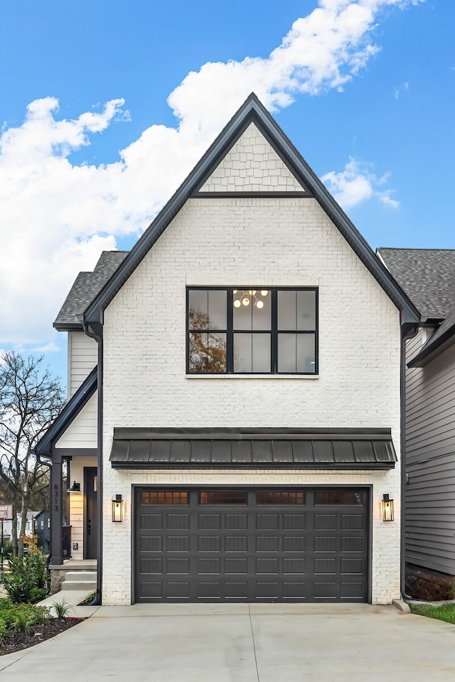 modern inspired farmhouse featuring a garage