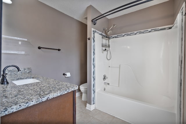 full bathroom featuring vanity, tile patterned floors, toilet, a textured ceiling, and shower / bathtub combination