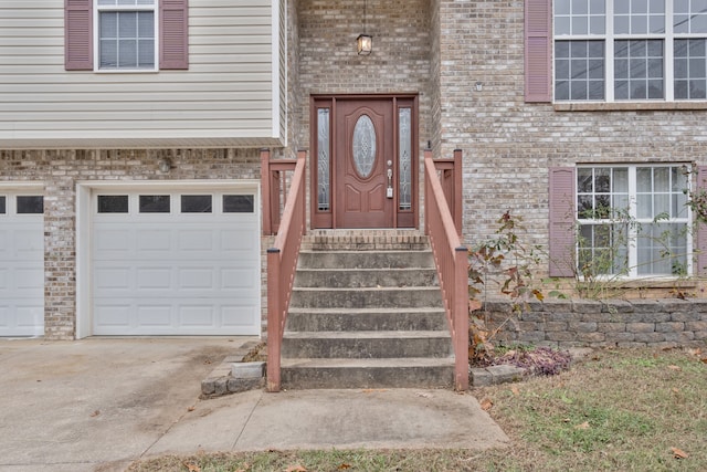 view of exterior entry with a garage