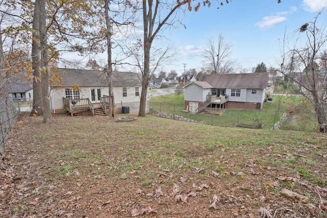 exterior space featuring a lawn and a deck