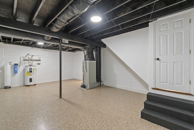 basement featuring heating unit and water heater