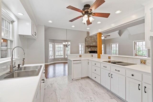 1055 Wades Branch Rd, Centerville, TN 37033 - kitchen featuring a sink, a fireplace, a ceiling fan, black electric cooktop, and recessed lighting