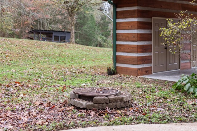 1055 Wades Branch Rd, Centerville, TN 37033 - view of green lawn featuring a fire pit