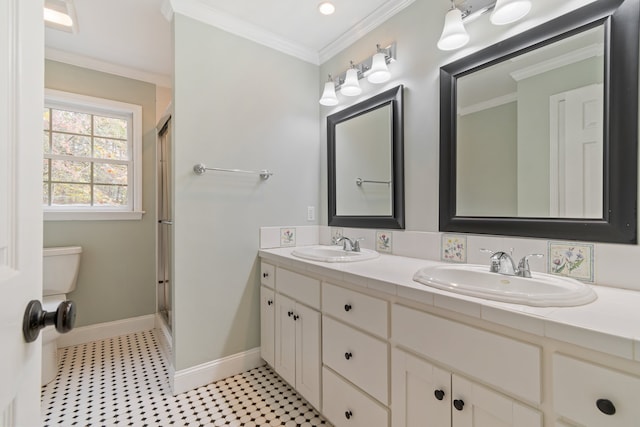 bathroom featuring toilet, vanity, an enclosed shower, and ornamental molding